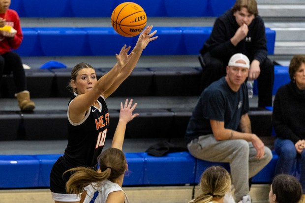 Lincoln-Way West's Molly Finn (10) hits a three pointer against Lincoln-Way East during a Southwest Suburban Conference game in Frankfort on Tuesday, Jan. 7, 2025. (Vincent D. Johnson / for the Daily Southtown)