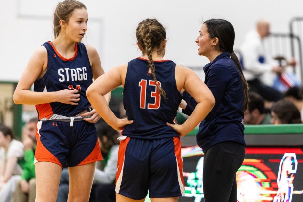 Stagg's Abbey Hobart, left, Samanta Linceviciute (13) and head coach Allison Hernandez talk during a free throw against Oak Lawn during a nonconference game in Oak Lawn on Saturday, Jan. 4, 2025. (Vincent D. Johnson / for the Daily Southtown)