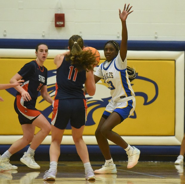 Stagg's Kacey Fitzpatrick (11) tries to get a shot off past Sandburg's Monique Nkwogu (13) during a SouthWest Suburban Conference game Tuesday, Jan. 21, 2025 in Orland Park, IL. (Steve Johnston/for the Daily Southtown)