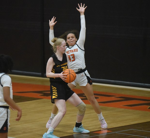 St. Laurence's Maeve McNamara (34) tries to work to the basket against Shepard's Jamaia Thompson (13) during a nonconference game Wednesday, Jan. 29, 2025 in Palos Heights, IL. (Steve Johnston/for the Daily Southtown)