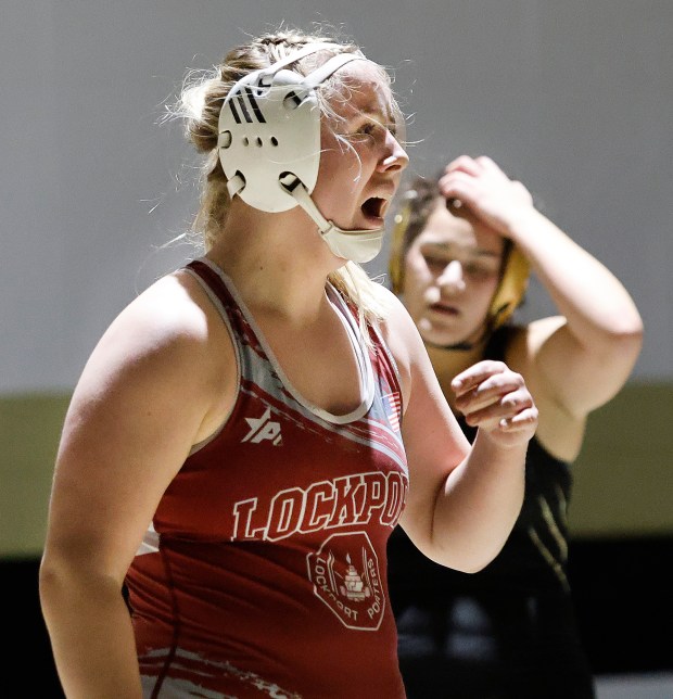 Lockport's Sophie Kelner (left) reacts after beating Oak Forest's Isabell Peralta (right) during a wrestling match at Oak Forest High School on Wednesday Jan. 15, 2025 (John Smierciak / Daily Southtown)