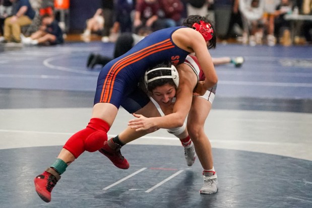 Lockport's Averi Colella shoots the legs of Romeoville's Daniela Santander during their 105 pound championship bout in the Aaron Dudley Memorial Girls Wrestling Invite at Oswego East High School on Saturday, Jan. 4, 2025. (Sean King / for The Daily Southtown)