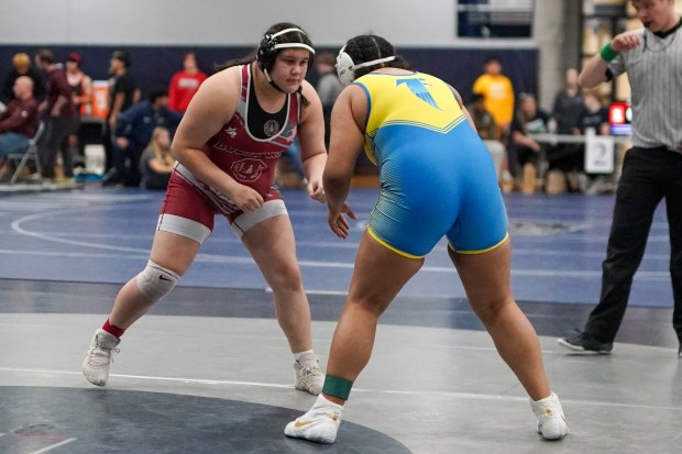 Lockport's Rebekah Ramirez (left) circles the mat against Wheaton North's Lana Victory during their 235 pound championship bout in the Aaron Dudley Memorial Girls Wrestling Invite at Oswego East High School on Saturday, Jan. 4, 2025. (Sean King / for The Daily Southtown)