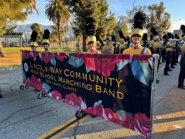 Members of the Lincoln-Way High School District 210 marching band prepare to step off Jan. 1, 2025, for the Tournament of Roses Parade in Pasadena, California. (Jenny Clark)