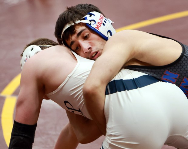 (144) Zach Stewart of Marmion Academy, right, and Aidan Arnett of Elmhurst (IC Catholic), left, during the 2025 Chicago Catholic League Championship wrestling tournament held at Montini Catholic High School in Lombard on Saturday, Jan. 25, 2025. (James C. Svehla / for the Daily Southtown)