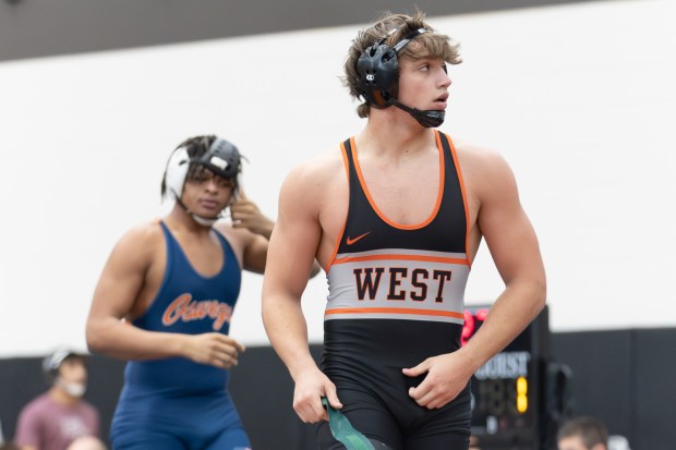 Lincoln-Way West's Nate Elstner walks off the Matt after wrestling Oswego's Christian Paige during a match in the Lincoln-Way West Mega Duals in New Lenox on Saturday, Jan. 11, 2025. (Troy Stolt / for the Daily Southtown)