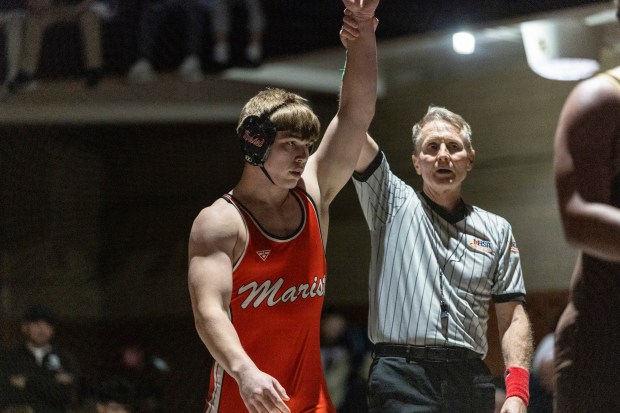 Marist's Ricky Ericksen III is declared the winner of the 190-pound match by fall over Mount Carmel's Kenneth Seggerson during a nonconference meet in Chicago on Friday, Jan. 10, 2025. (Vincent D. Johnson / for the Daily Southtown)