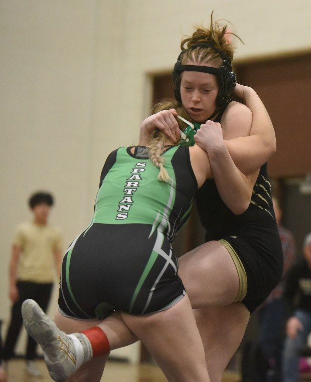 Oak Lawn's Charvelle Mclain wrestles Oak Forest's Adri Bille at 155 pounds during the South Suburban Conference Meet Saturday, Jan. 25, 2025 in Palos Heights, IL. (Steve Johnston/for the Daily Southtown)