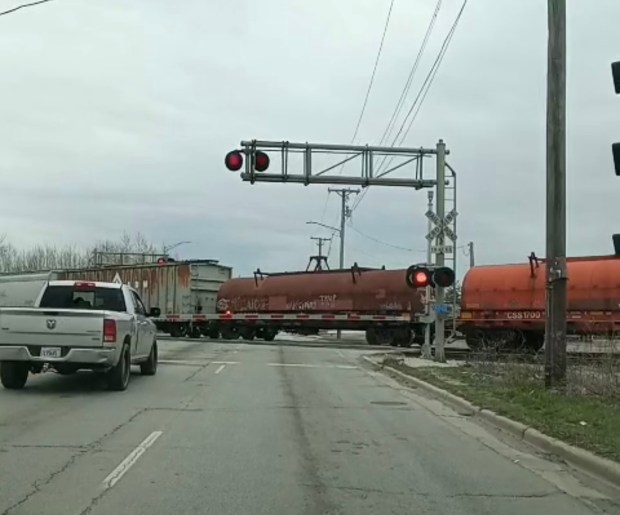 A screenshot from a video taken by Dixmoor resident Cynthia Mossuto of a train stopped on the tracks near 142nd Street and Western April 12, 2023. (Cynthia Mossuto)