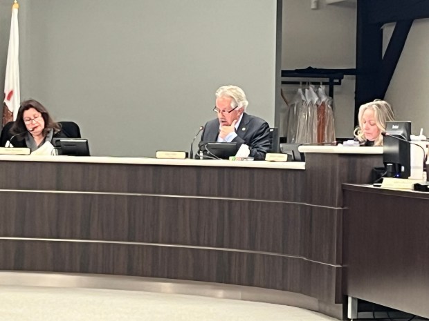 Homer Glen Trustee Dan Fialko, center, speaks Jan. 22, 2025, in favor of the township's request to waive $9,720 in fees for professional services related to the Homer Township Civic Center project. Homer Glen waived permit fees worth about $4,000 in July 2024 per an annexation agreement with the township. (Michelle Mullins/for the Daily Southtown)