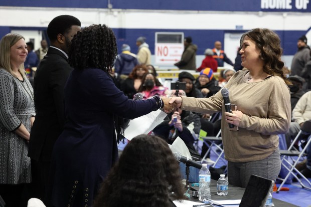 Stephanie Wiedeman, right, is congratulated after she was elected to be a Thornton Township trustee on Jan. 21, 2025. (Terrence Antonio James/Chicago Tribune)