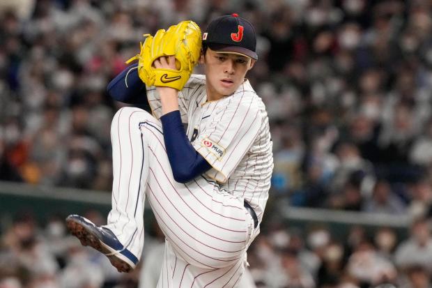 Japan's Roki Sasaki pitches during their Pool B game against the Czech Republic at the World Baseball Classic at the Tokyo Dome in Tokyo, on March 11, 2023. (AP Photo/Eugene Hoshiko)