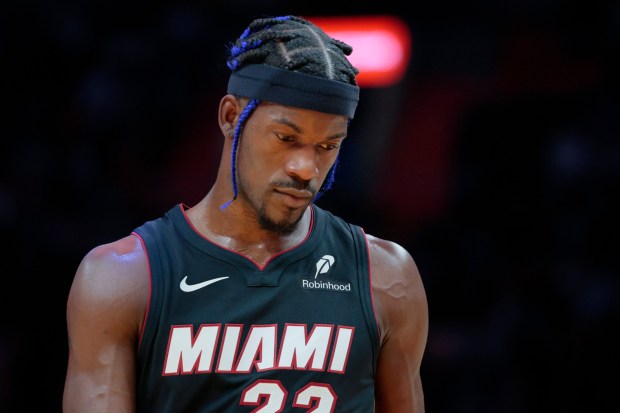 Heat forward Jimmy Butler walks off the court during a game against the Lakers on Dec. 4, 2024, in Miami. (Al Diaz/Miami Herald)