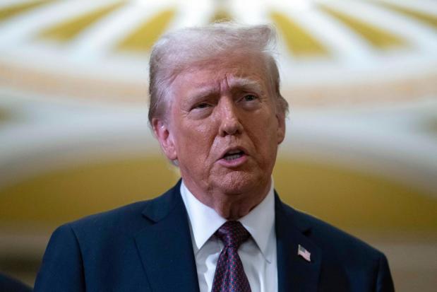 President-elect Donald Trump talks to reporters after a meeting with Republican leadership at the Capitol on Jan. 8, 2025, in Washington. (AP Photo/Jose Luis Magana)