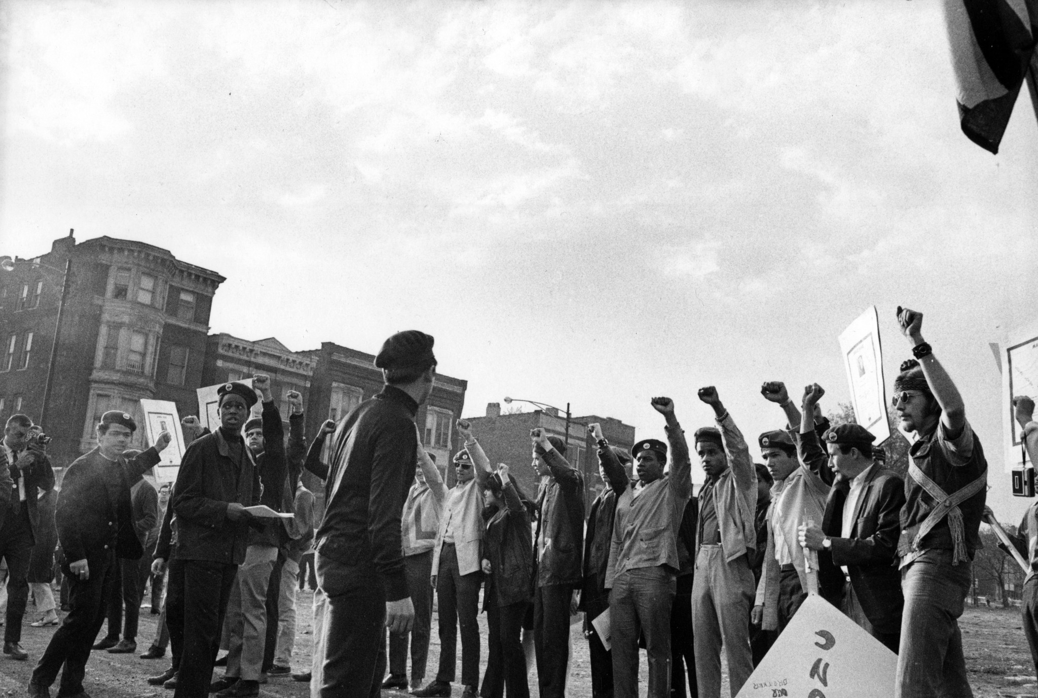 Members of the Young Lords with their fists in the...