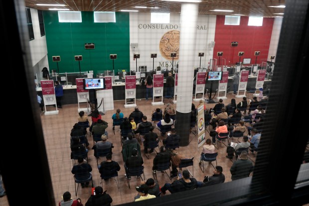 The Mexican Consulate of Chicago was full on Feb. 13, 2024, as people wait for passports, visas and paperwork. (Antonio Perez/Chicago Tribune)