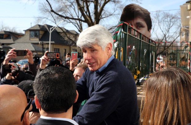 Former Gov. Rod Blagojevich, center, goes back into his home after holding a news conference on Feb. 19, 2020, hours after being released from federal prison. His sentence was commuted by President Donald Trump. (Terrence Antonio James/Chicago Tribune)