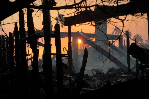 The sun rises after the Palisades Fire ravaged an area in the Pacific Palisades neighborhood of Los Angeles, Jan. 9, 2025. (Damian Dovarganes/AP)