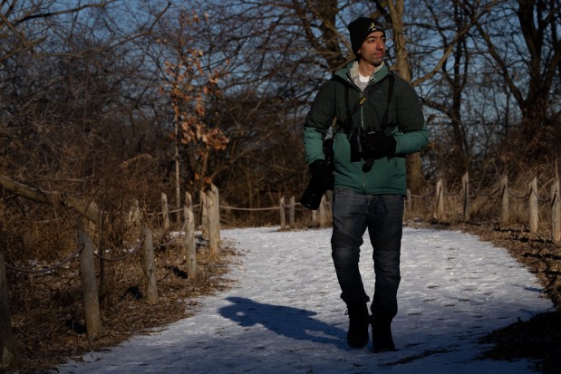 Tarik Shahzad walks around Montrose Point Bird Sanctuary in Chicago on Jan. 24, 2025, while bird-watching. Shahzad set a record by identifying 294 birds in Cook County in 2024. (Audrey Richardson/Chicago Tribune)