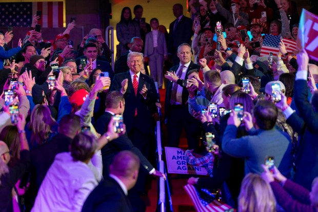 President-elect Donald Trump is appluaded by supporters as he arrives at a victory rally at Capitol One Arena in Washington on Sunday night, Jan. 19, 2025, the eve of his inauguration as president for a second term. (Doug Mills/The New York Times)