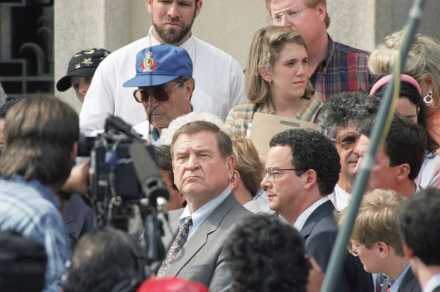 Rep. Dan Rostenkowski, D-Ill., center, leaves U.S. District Court in Washington on June 10, 1994, after his arraignment. (Denis Cook/AP)