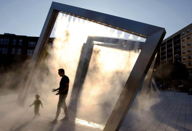 Stainless steel arches spray mist on visitors at Mary Bartelme Park in the West Loop in 2010. (Phil Velasquez/Chicago Tribune)