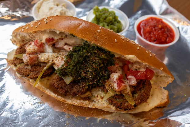 Falafel on a ka'ak sesame loaf at the falafel and burger spot Ragadan, Oct. 25, 2022, in Uptown. (Erin Hooley/Chicago Tribune)