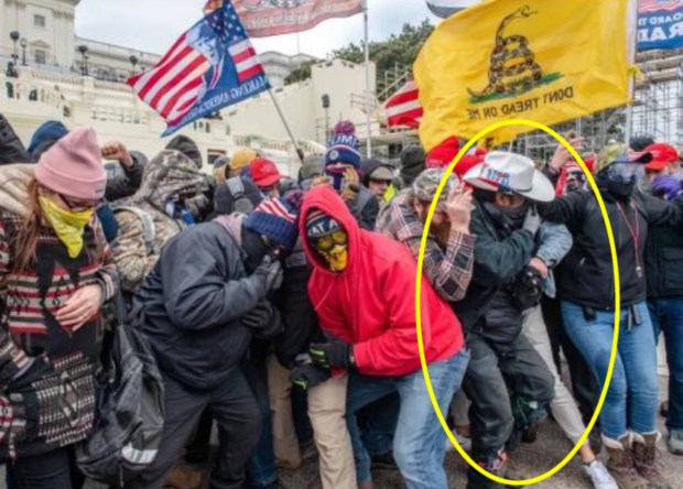 According to court documents, this image shows John Banuelos, 39, of Summit, Illinois, circled in yellow, during the Jan. 6, 2021, insurrection at the U.S. Capitol. (Federal court document)