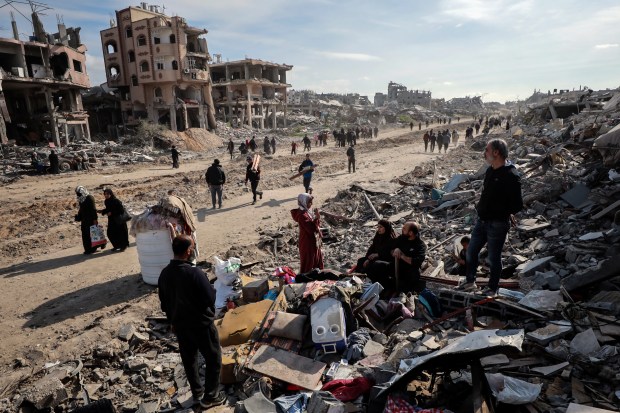 Palestinians inspect the destruction caused by the Israeli air and ground offensive in Jabaliya, as a ceasefire deal between Israel and Hamas went into effect on Jan. 19, 2025. (Abed Hajjar/AP)