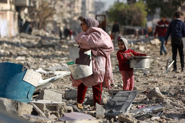 Palestinians inspect the destruction caused by the Israeli air and ground offensive in Jabaliya, as a ceasefire deal between Israel and Hamas went into effect on Jan. 19, 2025. (Abed Hajjar/AP)