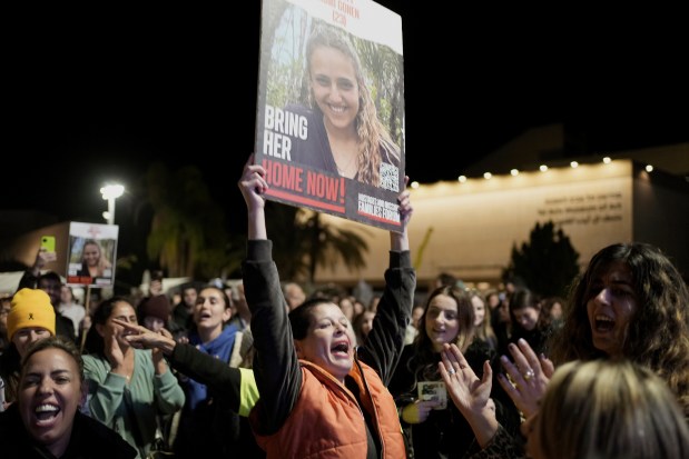 Relatives and friends of people killed and abducted by Hamas and taken into Gaza, react to the news of the hostages' release, as they gather in Tel Aviv, Israel on Jan. 19, 2025. (Maya Alleruzzo/AP)