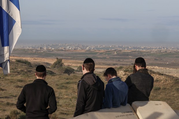 Israelis look at the ruins of Beit Hanoun from a hill in Sderot, Israel on Jan.19, 2025. (Avishag Shaar-Yashuv/The New York Times)