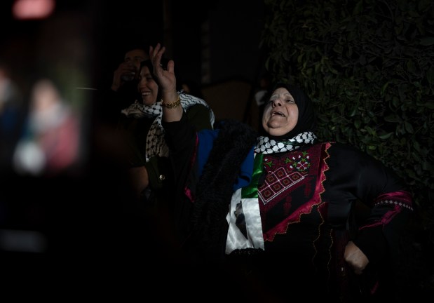 Palestinians gather to await the release of prisoners following the ceasefire agreement started between Israel and Hamas, in Ramallah, West Bank, on Sunday, Jan. 19, 2025. The initial stage of a truce between Israel and Hamas prompted celebrations in Gaza and hope for an end to the 15-month war. (Afif Amireh/The New York Times)