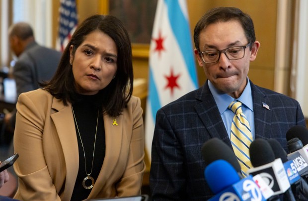 Ald. Silvana Tabares, 23rd, and Ald. Raymond Lopez, 15th, talk to reporters after colleagues decline to vote on their proposal to alter Chicago's welcoming city policy during a City Council meeting on Jan. 15, 2025, at City Hall. (Brian Cassella/Chicago Tribune)