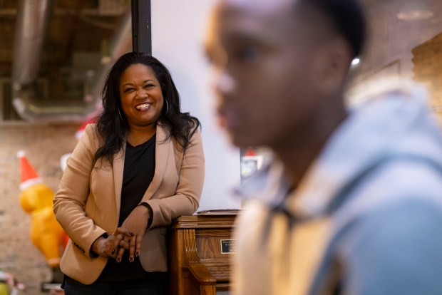 Founder Sheila Fortson watches Matthew Thomas, 14, begin his piano lesson Dec. 11, 2024, at the FAME Center in the South Loop. (Brian Cassella/Chicago Tribune)