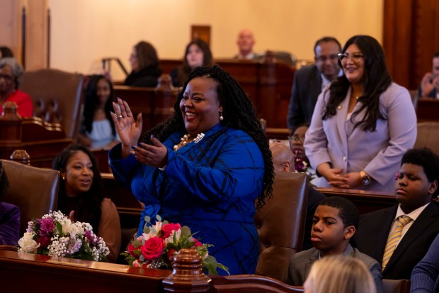 State Sen. Lakesia Collins and state Sen. Graciela Guzman celebrate after being sworn in on Jan. 8, 2025, in Springfield. (Brian Cassella/Chicago Tribune)