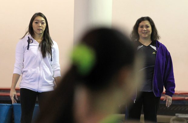 2012 Olympian, Anna Li, left, and her mother, Jiani Wu, a 1984 Olympian, watch gymnasts during practice at Legacy Elite Gymnastics in 2012. (Stacey Wescott/Chicago Tribune) 