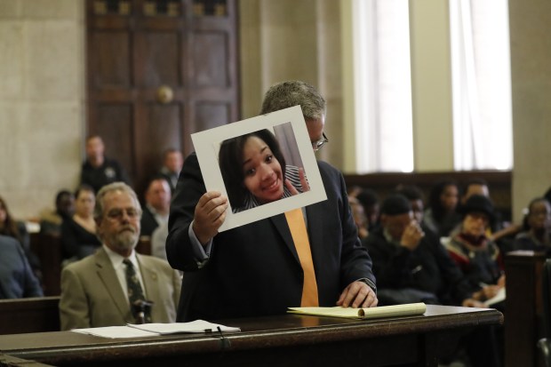 Prosecuting attorney Brian Holmes holds a photograph of Hadiya Pendleton as he speaks at the sentencing of Micheail Ward, at the Leighton Criminal Court Building on Jan., 14, 2019. Ward was found guilty of first-degree murder and aggravated battery in the slaying, but an appeals court overturned his conviction. (Jose M. Osorio/Chicago Tribune)