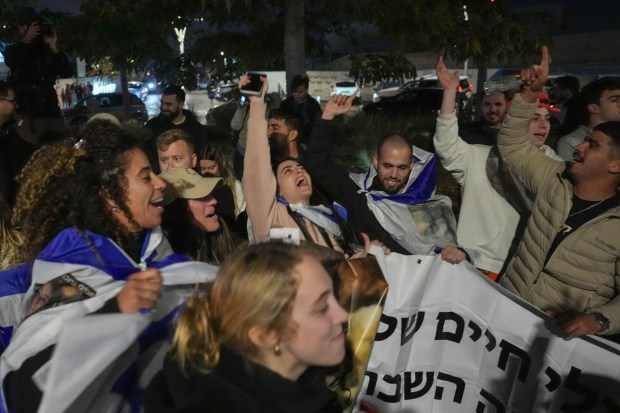 Israelis celebrate the release of three hostages who had been held captive by Hamas in Gaza as they gather in Tel Aviv, Israel, Sunday, Jan. 19, 2025. (Photo/Ariel Schalit)