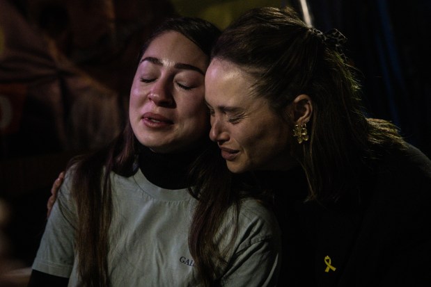 Women gathered in what's known as Hostages Square cry and embrace as they react to news that the first Israeli hostages have been released after a ceasefire agreement began between Israel and Hamas on Jan. 19, 2025, in Tel Aviv, Israel. (Chris McGrath/Getty)