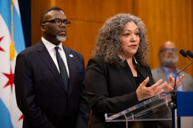 Beatriz Ponce de León, Chicago's deputy mayor for immigrant, migrant and refugee rights, speaks alongside Mayor Brandon Johnson during a press conference about changes to the shelter system on Oct. 21, 2024, at City Hall. (Brian Cassella/Chicago Tribune)