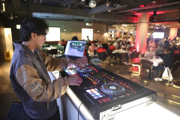 Mark Erpelo, known professionally as DJ Marquee, works in the United Center Concert Club prior to a Chicago Bulls basketball game on Dec. 28, 2024. (Talia Sprague/for the Chicago Tribune)