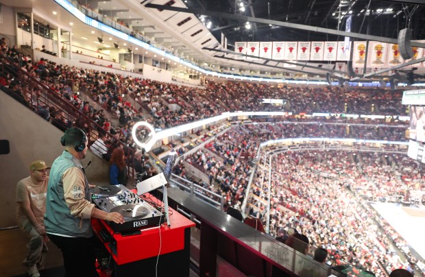 Christian Matta, known as DJ Metro, works a turntable during a Chicago Bulls game at the United Center on Dec. 28, 2024. (Talia Sprague/for the Chicago Tribune)