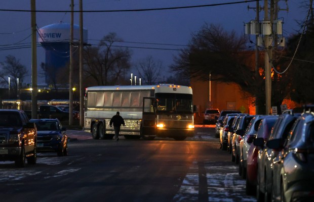 A bus containing undocumented immigrants pulls out from the U.S. Immigration and Customs Enforcement facility in Broadview on Jan. 3, 2025, as it heads to the airport in Gary, Indiana for deportations. (Stacey Wescott/Chicago Tribune)