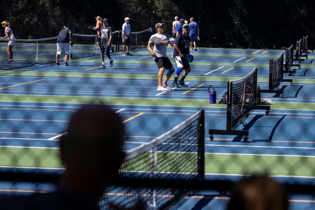 Amateurs compete in pickleball matches on Aug. 31, 2022, at Danny Cunniff Park in Highland Park. The pickleball craze is makes waves in the travel industry. (Brian Cassella/Chicago Tribune)