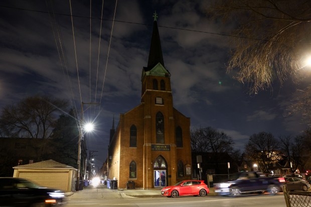 Vehicles drive past the Lincoln United Methodist Church on Dec. 22, 2024. The church holds two services on Sunday, an English service in the morning and mostly Spanish service in afternoon but with President-elect Donald Trump's mass deportation threats the afternoon service has moved to an online worships service. (Armando L. Sanchez/Chicago Tribune)