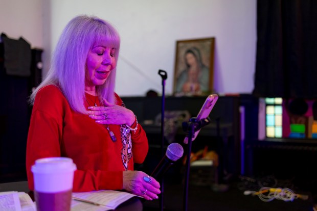 Pastor and community activist Emma Lozano helps lead a virtual service online from the empty sanctuary on Dec. 29, 2024, at Lincoln Methodist Church in Pilsen. (Brian Cassella/Chicago Tribune)