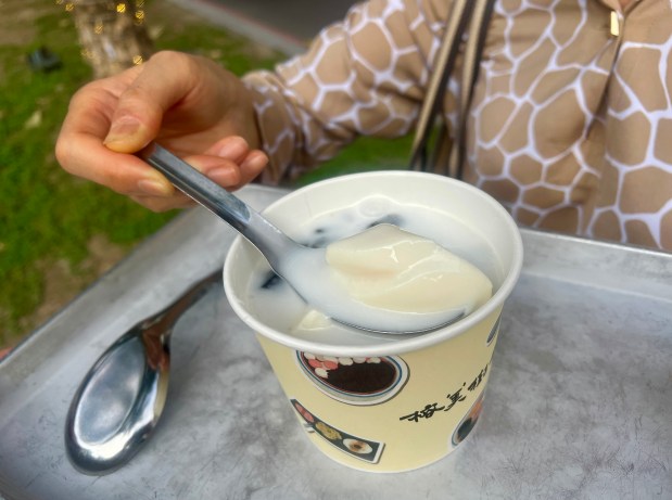 Amber Gibson's mom, Chi-Pei Gibson, has a bowl of chilled tofu pudding with slippery grass jelly, her favorite childhood snack. (Amber Gibson)