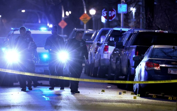 Chicago Police process a crime scene after a shooting in the 800 block of North Trumbull Avenue in Chicago on Dec. 26, 2024. (Terrence Antonio James/Chicago Tribune)