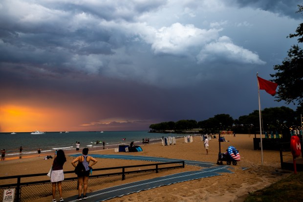 A storm rolls in at Ohio Street Beach after a day of the heat index at triple digits on Aug. 27, 2024. (Tess Crowley/Chicago Tribune)